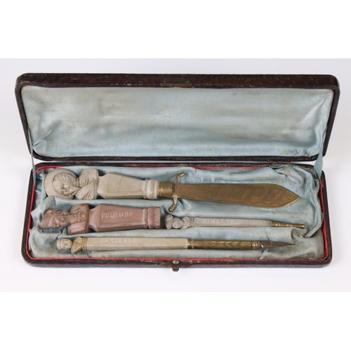 236 - A cased Grand Tour desk set to include letter opener, seal, pencil and pen.