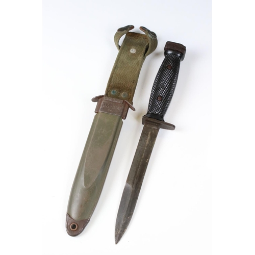 239 - A United State Korean War era M5 bayonet complete with scabbard and frog.