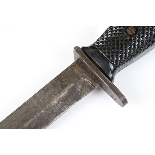 239 - A United State Korean War era M5 bayonet complete with scabbard and frog.