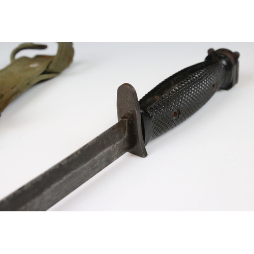 239 - A United State Korean War era M5 bayonet complete with scabbard and frog.