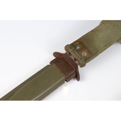 239 - A United State Korean War era M5 bayonet complete with scabbard and frog.