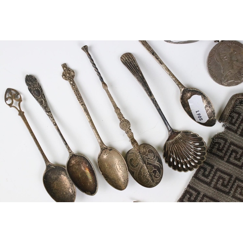 244 - A small group of silver collectables to include tea spoons, anointing spoon, hallmarked silver holde... 