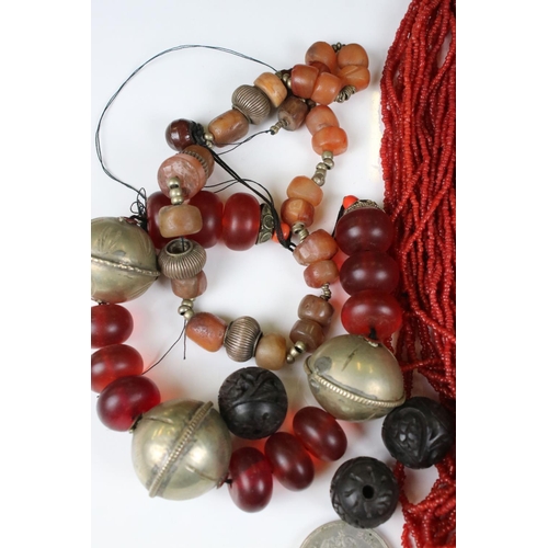 245 - A small collection of vintage ethnic / asian jewellery to include a coral beaded necklace.