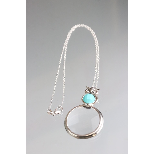 260 - Silver owl shaped magnifying pendant necklace with turquoise cabochon