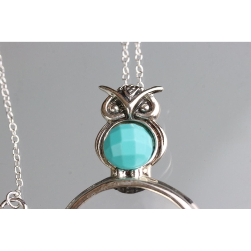 260 - Silver owl shaped magnifying pendant necklace with turquoise cabochon