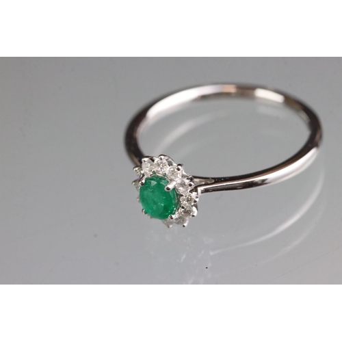 278 - 18ct white gold emerald and diamond ring of 60 points total