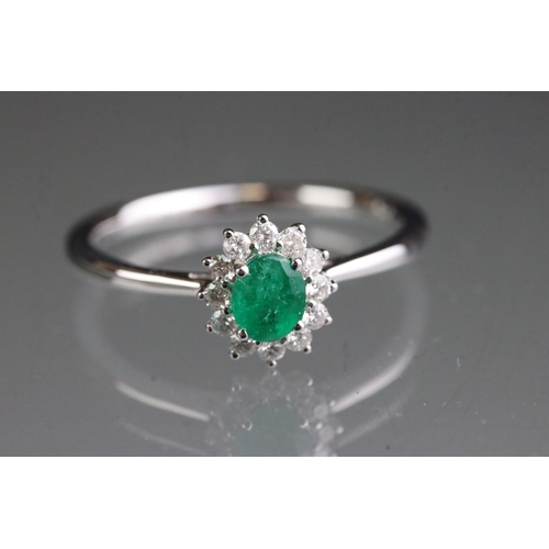 278 - 18ct white gold emerald and diamond ring of 60 points total