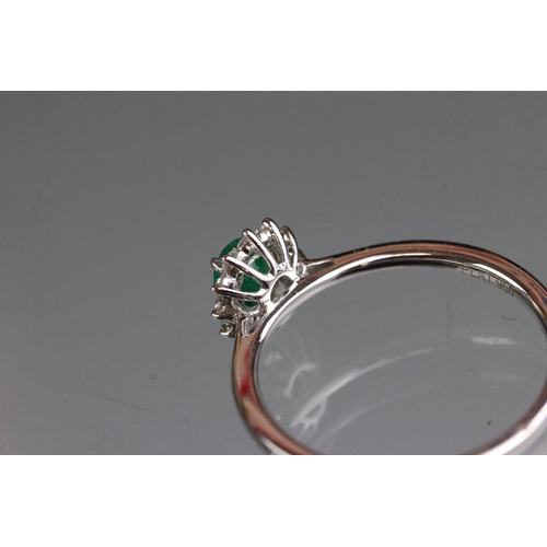 278 - 18ct white gold emerald and diamond ring of 60 points total