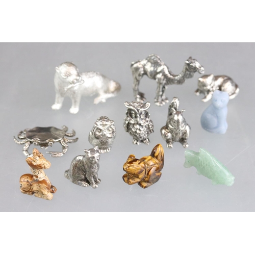 279 - A collection of miniature animal figures to include white metal and stone examples.