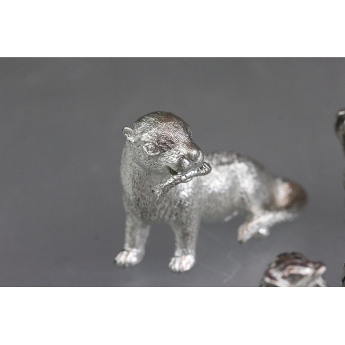 279 - A collection of miniature animal figures to include white metal and stone examples.