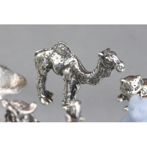 279 - A collection of miniature animal figures to include white metal and stone examples.