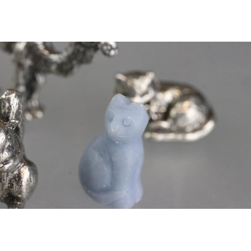 279 - A collection of miniature animal figures to include white metal and stone examples.