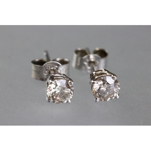 281 - Pair of 14ct white gold diamond stud earrings of 65 points total