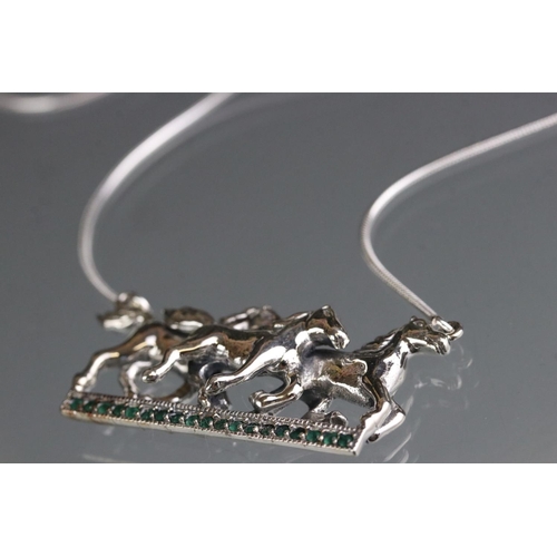 282 - Silver galloping horse pendant necklace on sapphire set platform