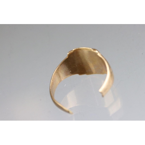 284 - A fully hallmarked 22ct gold wedding band together with a yellow metal signet ring.