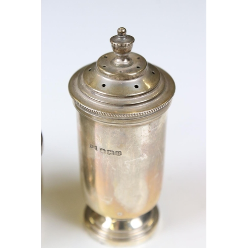 295 - A fully hallmarked sterling silver cruet set to include pepperette, salt and spoon with liner and mu... 