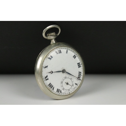 309 - A vintage top winding pocket watch in white metal case with sub second dial to 6 o'clock.