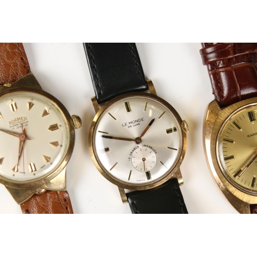 312 - A collection of five vintage gents wristwatches to include Avia, Montine, Garrard, Le Monde and Roam... 