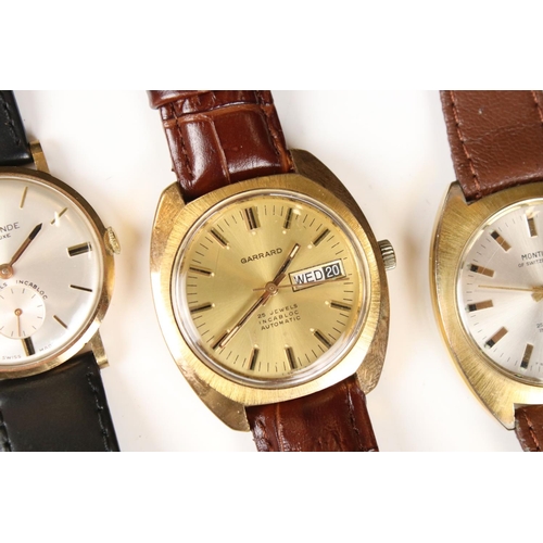 312 - A collection of five vintage gents wristwatches to include Avia, Montine, Garrard, Le Monde and Roam... 