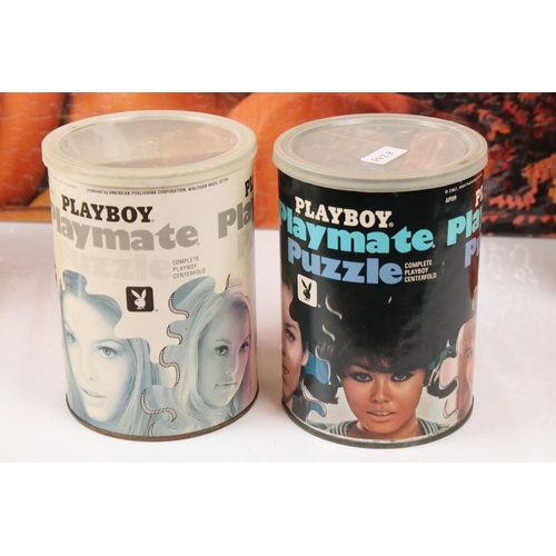 319 - A small collection of playboy jigsaw puzzles to include tin boxed examples.