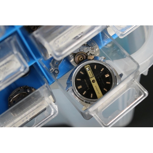 320 - A large collection of watches, watch parts, watch repair tools and related literature.