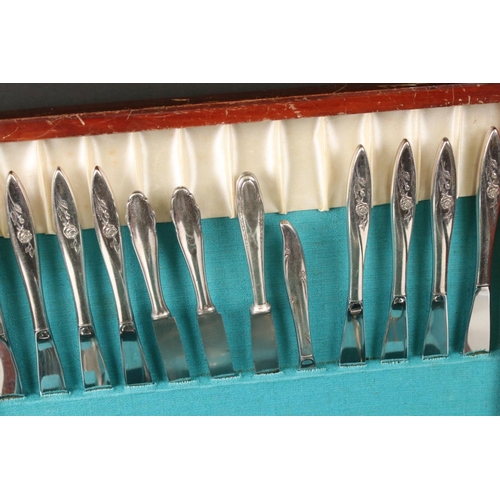 332 - Two wooden cased sets of cutlery to include a fish knife and fork set.