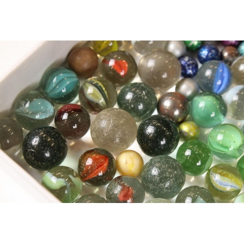 336 - A small box of mixed collectables to include marbles, tea cards to include loose and mounted example... 