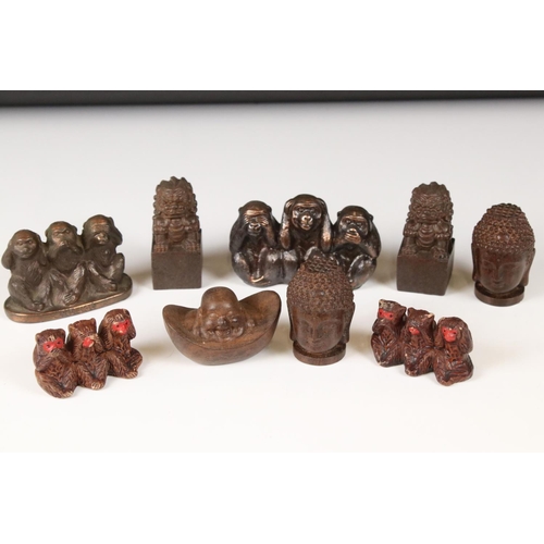 344 - A small collection of ornamental figures to include the three wise monkeys, foo dogs and Buddha head... 