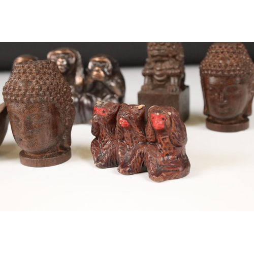 344 - A small collection of ornamental figures to include the three wise monkeys, foo dogs and Buddha head... 