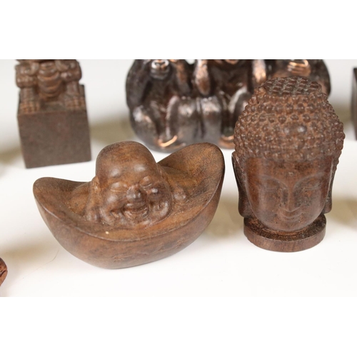 344 - A small collection of ornamental figures to include the three wise monkeys, foo dogs and Buddha head... 