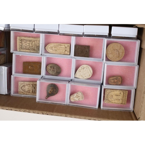 351 - A large collection of Thai budhist amulets contained within individual display boxes.