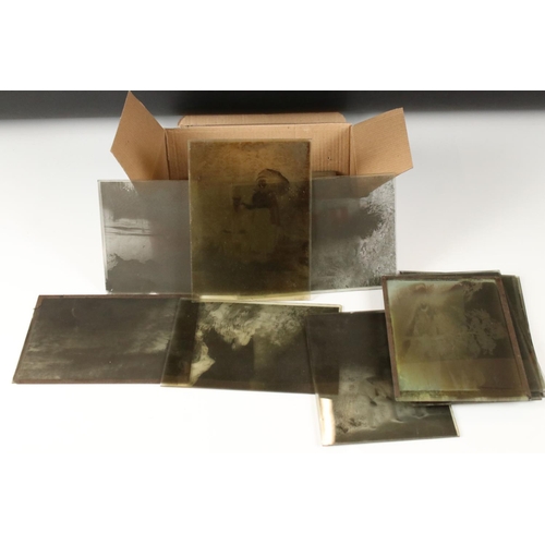 377 - A collection of half plate victorian glass negatives of social history and vintage life.