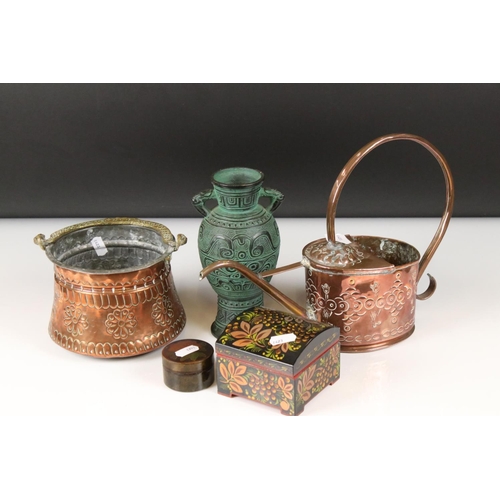 455 - An early 20th century copper watering can and planter together with two trinket boxes and an urn.