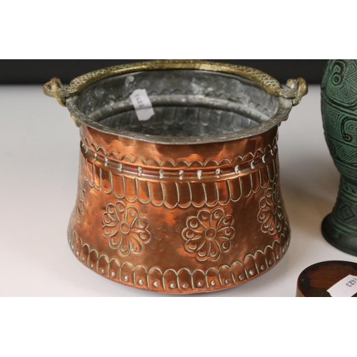 455 - An early 20th century copper watering can and planter together with two trinket boxes and an urn.