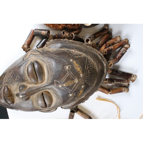 463 - Two African Tribal Ivory Coast Wooden Dan Masks with Cowrie Shell decoration, 28cm high together wit... 