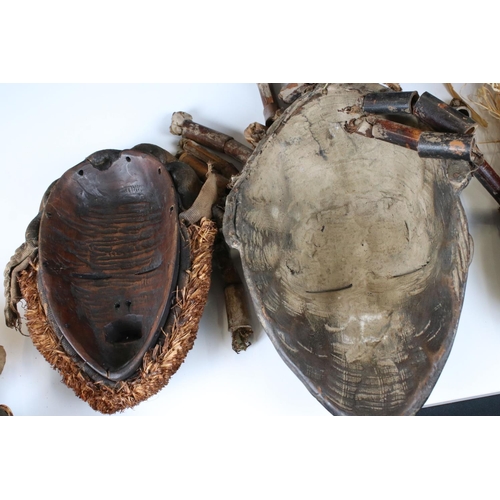 463 - Two African Tribal Ivory Coast Wooden Dan Masks with Cowrie Shell decoration, 28cm high together wit... 