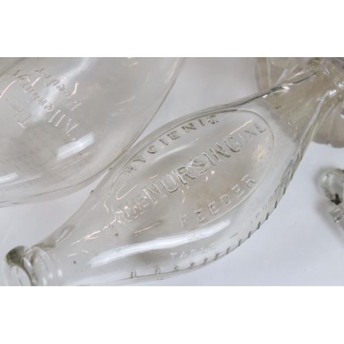 467 - Collection of Early 20h century Glass Baby Feeding Bottles, two in their original retail boxes plus ... 