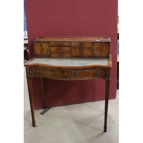 559 - 20th century Mahogany Serpentine Ladies Writing Desk, the superstructure with two cupboards and six ... 