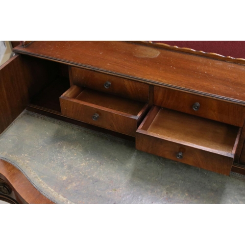 559 - 20th century Mahogany Serpentine Ladies Writing Desk, the superstructure with two cupboards and six ... 