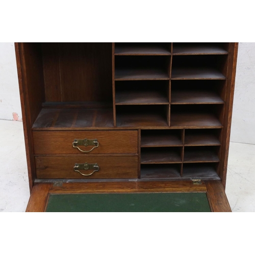 560 - Early 20th century Oak Writing / Stationery Cupboard, the fall front with green baise surface to ins... 