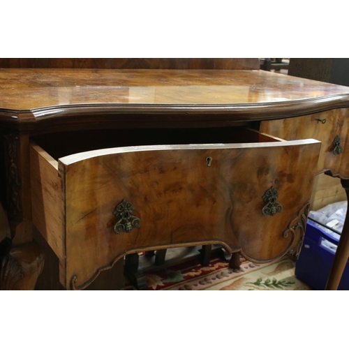 561 - Early 20th century Queen Anne style Walnut Side Table of serpentine outline, with two deep drawers, ... 