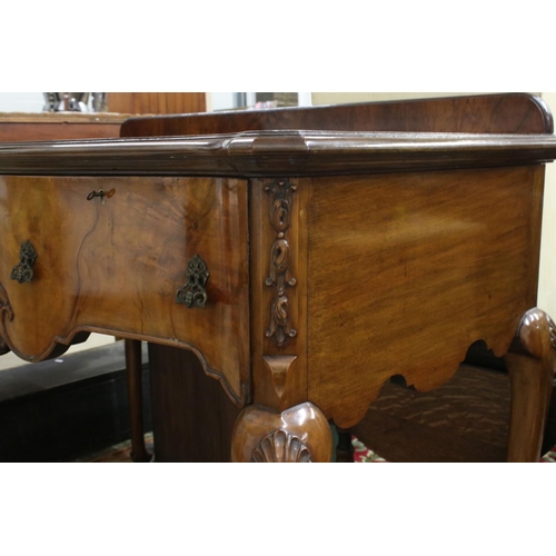 561 - Early 20th century Queen Anne style Walnut Side Table of serpentine outline, with two deep drawers, ... 