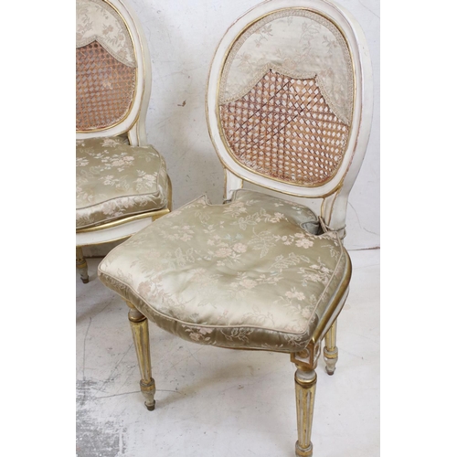 572 - Set of Four Louis XVI style Cream Painted and Gilt decorated Salon Chairs raised on turned tapering ... 