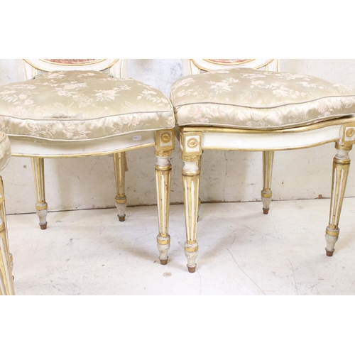 572 - Set of Four Louis XVI style Cream Painted and Gilt decorated Salon Chairs raised on turned tapering ... 