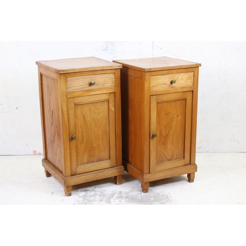 580 - Two matching Elm Bedside Cupboards in the Art Deco manner, each with drawer over a cupboard door, ea... 