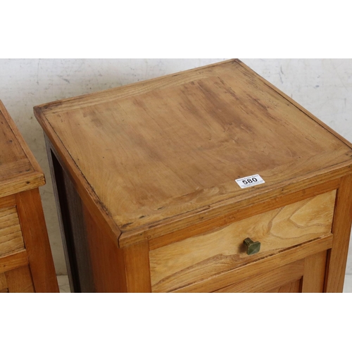 580 - Two matching Elm Bedside Cupboards in the Art Deco manner, each with drawer over a cupboard door, ea... 