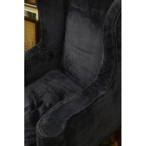 591 - High Wick Back Armchair in the Queen Anne style, upholstered in blue fabric, raised on front cabriol... 