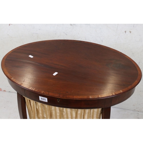 605 - Early 20th century Mahogany Work / Sewing Table of oval outline, the hinged lid opening to a section... 