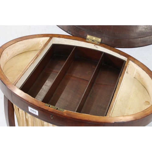 605 - Early 20th century Mahogany Work / Sewing Table of oval outline, the hinged lid opening to a section... 