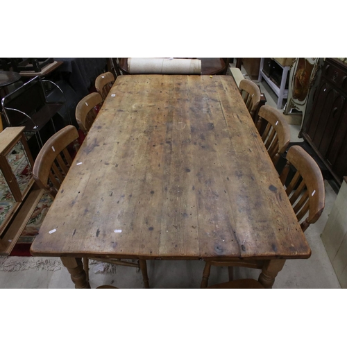 609 - Large Pine Kitchen Table raised on turned legs, 183cm long x 95cm wide x 77cm wide together with a s... 